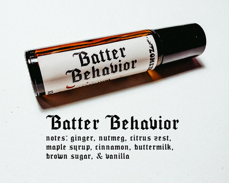 Roll-on bottle labeled 'Batter Behavior' with description of notes on a white background