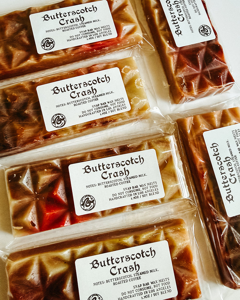 brown and red wax bars with a white label "Butterscotch Crash".