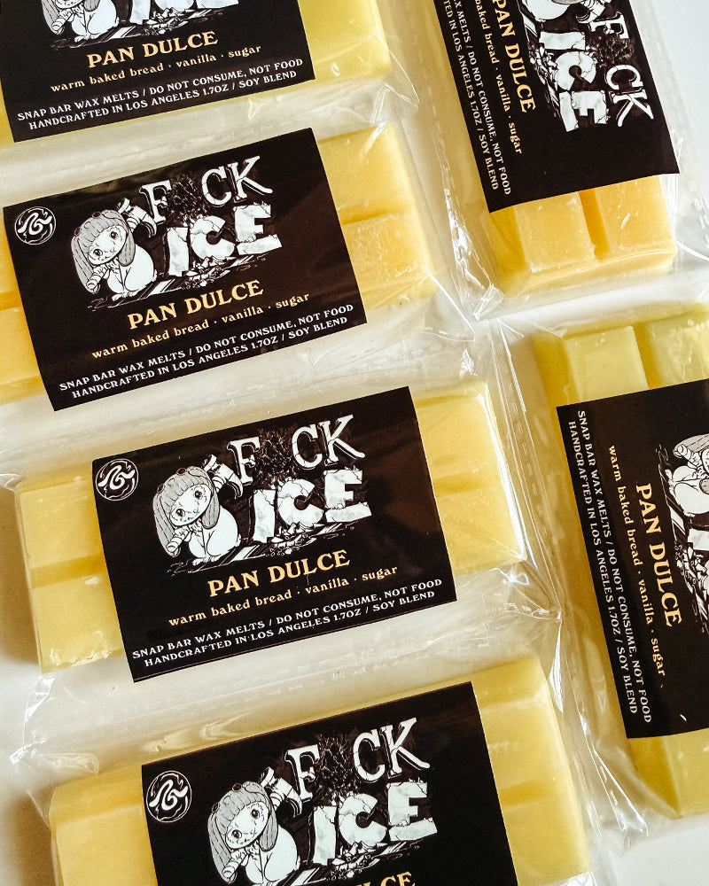 Pan Dulce wax bars with black labels on a white background