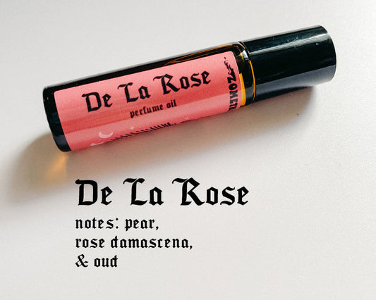 De La Rose perfume oil bottle on a light background