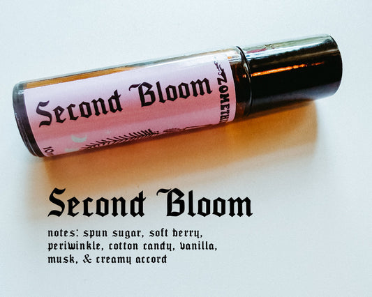 Roll-on bottle labeled 'Second Bloom' with product description on a light background