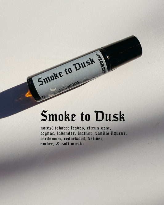 Roll-on bottle labeled 'Smoke to Dusk' on a light gray background