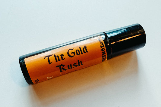 Roll-on bottle labeled 'The Gold Rush' on a light background